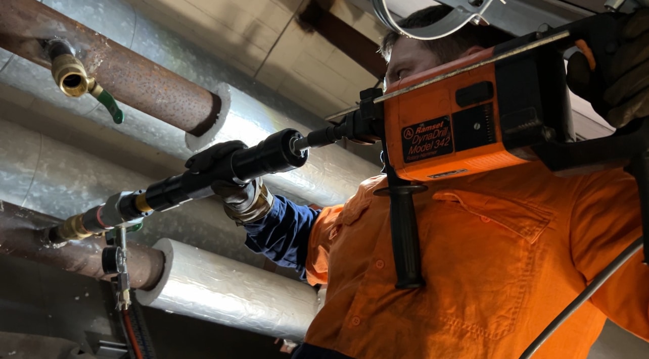 Man is fixing a pipeline